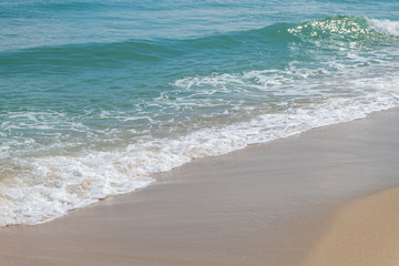HDR shot of sea shore with wave and white sand during summer day in thailand (selective focus and...