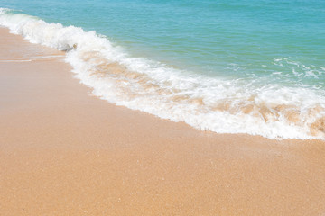 HDR shot of sea shore with wave and white sand during summer day in thailand (selective focus and white balance / color tone shift )