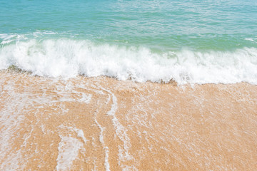 HDR shot of sea shore with wave and white sand during summer day in thailand (selective focus and...