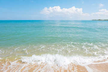 HDR shot of sea shore with wave and white sand during summer day in thailand (selective focus and white balance / color tone shift )