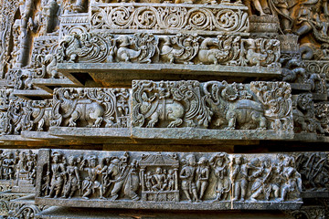 Friezes of animals, scenes from mythological episodes from Ramayana and Mahabharata, at the base of temple, Hoysaleshwara temple, Halebidu, Karnataka