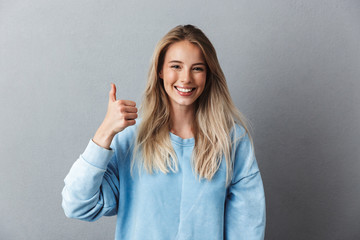 Portrait of a lovely young girl in blue sweatshirt