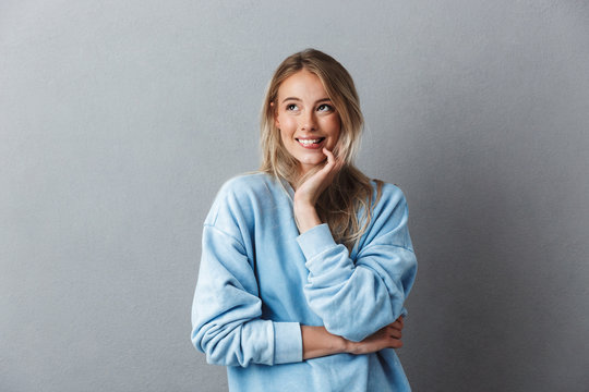 Portrait of a lovely young girl in blue sweatshirt
