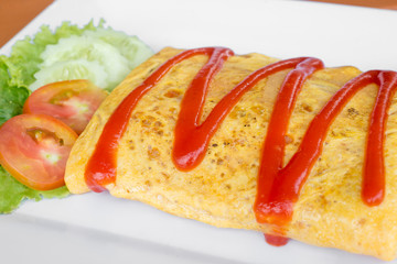 Omelet with vegetable salad Thai adaptive fashion cuisine with selective focus
