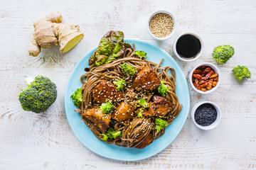 Delicious teriyaki chicken with soba noodles and sesame seeds.