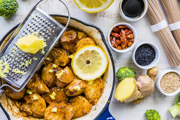 Ingredients to prepare teriyaki from chicken with soba noodles and sesame seeds.
