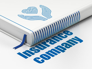 Insurance concept: closed book with Blue Heart And Palm icon and text Insurance Company on floor, white background, 3D rendering