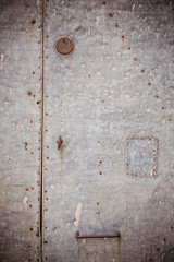 Close-up of an old rusty metal door. Front door. Metal texture