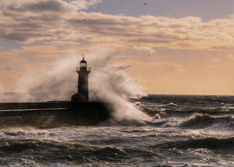 Big storm near a lighthouse in Oporto, Portugal