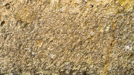 Background of old yellow stone texture.