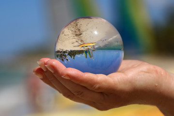 Beach through a glass ball