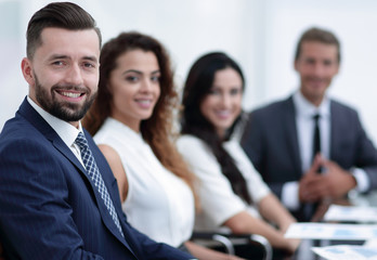 group of business people sitting at the desktop