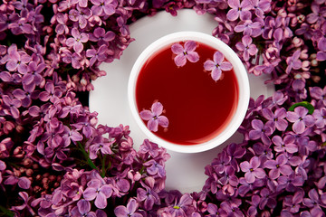 Cup of tea and bouquet  lilac