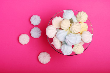 A vase full of meringues cakes