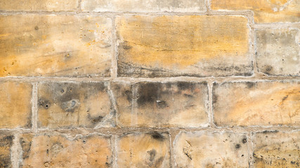 Background of old yellow stone texture.