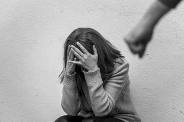 Man beating up his wife illustrating domestic violence