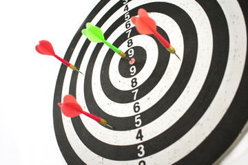 dart board and javelin in target