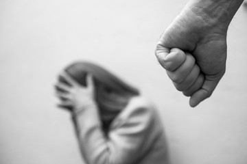 Man beating up his wife illustrating domestic violence