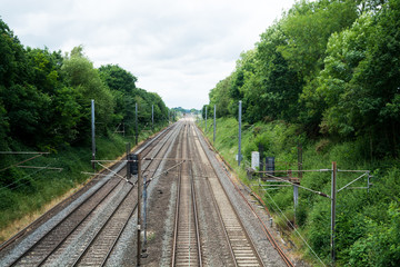 Fototapeta na wymiar Train tracks, long straight rail tracks with no train