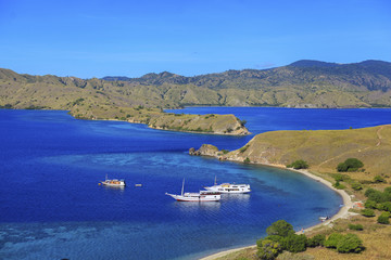 Tourist boats at Gili lawa island with a clear blue sea, Flores, Indonesia .