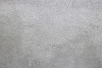 Abstract texture of decorative plaster. Grunge background of stucco texture. Gray painted surface.