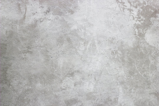 Abstract texture of decorative plaster. Grunge background of stucco texture. Gray painted surface.