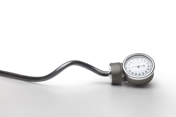 Blood pressure measurer against grey background. Clipping path