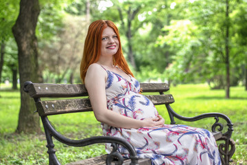 Pregnant women enjoy in the park