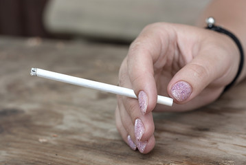  Don't smoke. A cigarette in a woman's hand