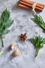Herbs and spices set on white textured background, top view, selective focus.