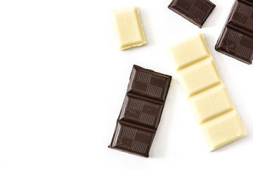Black and white chocolate bars isolated on white background. Top view. Copyspace