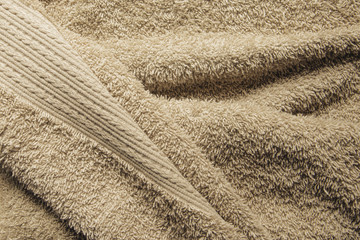 Beige Bath Towel. Folded Towel Texture. Bathroom Accessories Background