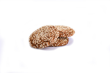 Isolated on white. Oatmeal cookies with sesame seeds