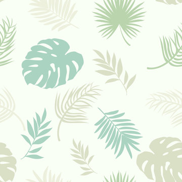 seamless pattern with silhouettes of palm leaves
