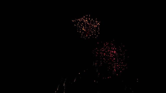 Fireworks flashing in the night holiday sky