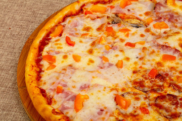 Pizza with ham and sausages
