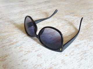 Fototapeta na wymiar Sunglasses on a light table