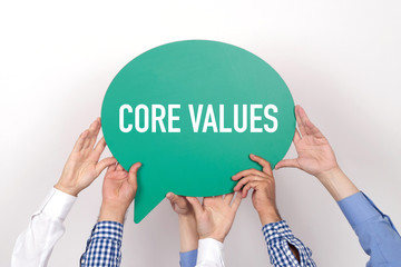 Group of people holding the CORE VALUES written speech bubble