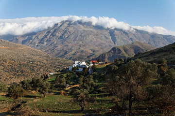 Greek village surrounded by mountains