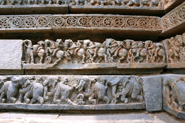 Friezes of cavalry forces and elephants, at the base of temple, Kedareshwara temple, Halebidu, Karnataka