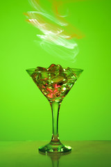  a martini glass on a green background