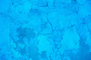 Photo of the intense blue colored rough stucco wall texture