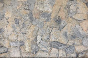 Stones come together The wall is background.