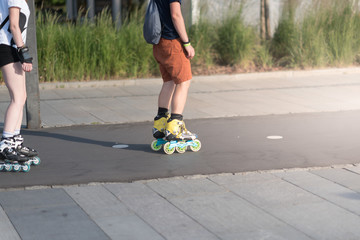 Close-up view of legs in roller blades