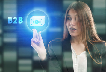 The concept of business, technology, the Internet and the network. A young entrepreneur working on a virtual screen of the future and sees the inscription: B2B