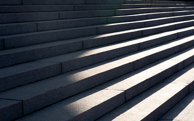 Horizontal view of shadows projected on the granite stairs