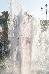 The gush of water of a fountain. Splash of water in the fountain, abstract image.Foam in the sea. The gush of water of a fountain. Splash of water in the fountain, abstract image.