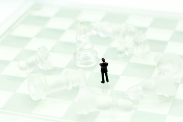 Chess business with miniature people : businessman  idea for competition, success and leadership concept.