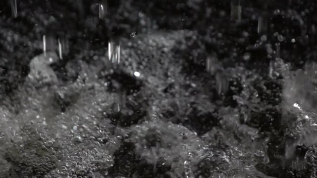 Water falling splash with surface water, slow motion