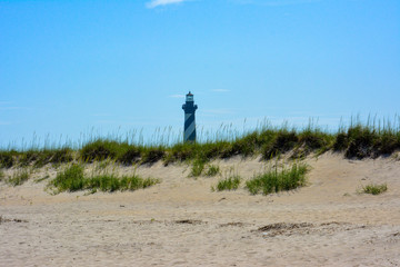 Cape Hatteras Lighthouse over the dunes along the beach